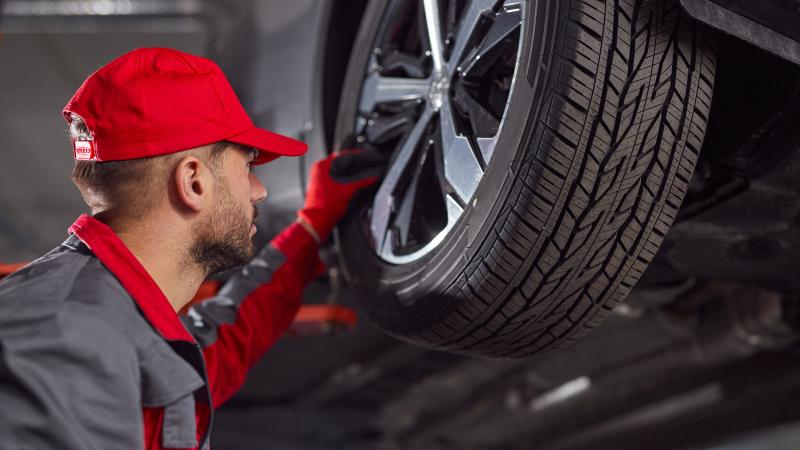 tire mechanic red hat